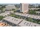 Aerial view of condo community near office buildings and highway at 4611 W Fig St # 209, Tampa, FL 33609