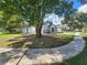 Single story house with a landscaped yard and curved sidewalk at 13625 Laraway Dr, Riverview, FL 33579