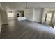 Open living room, kitchen, and dining area with gray floors at 13625 Laraway Dr, Riverview, FL 33579