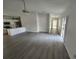 Open concept living and kitchen area with gray flooring at 13625 Laraway Dr, Riverview, FL 33579