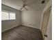 Spacious bedroom with neutral walls, wood-look flooring and a double door closet at 13625 Laraway Dr, Riverview, FL 33579