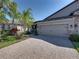 House exterior with brick and gray siding at 19343 Hawk Valley Dr, Tampa, FL 33647