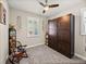 Guest bedroom with a wall bed, window shutters, and plenty of storage at 19343 Hawk Valley Dr, Tampa, FL 33647