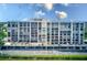 Large building with covered parking and water views at 220 Belleview Blvd # 802, Belleair, FL 33756