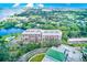 Aerial view of a condo building with pool and waterfront access at 220 Belleview Blvd # 802, Belleair, FL 33756