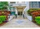 Well-maintained building entrance with landscaping and easy access at 220 Belleview Blvd # 802, Belleair, FL 33756