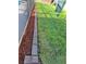 Nicely landscaped backyard with green grass, brick border, and mulch ground cover at 7906 Willow Brook Ct, Hudson, FL 34667