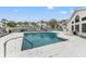 Community pool with lounge chairs and surrounding condos at 12267 Armenia Gables Cir # 12267, Tampa, FL 33612