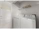Bright laundry room with shelf and updated appliances at 12267 Armenia Gables Cir # 12267, Tampa, FL 33612