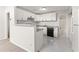 Modern kitchen featuring white cabinets and granite countertops at 12267 Armenia Gables Cir # 12267, Tampa, FL 33612