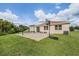 Home exterior and backyard with patio and basketball hoop at 11537 Southern Creek Dr, Gibsonton, FL 33534
