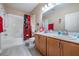 Clean bathroom with double vanity, shower, and tub at 11537 Southern Creek Dr, Gibsonton, FL 33534