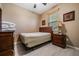 Small bedroom with a double bed and wooden furniture at 11537 Southern Creek Dr, Gibsonton, FL 33534