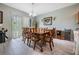 Bright dining room featuring a wood table and chairs, and hardwood floors at 11537 Southern Creek Dr, Gibsonton, FL 33534