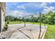 Spacious backyard patio with gazebo, basketball court, and lush landscaping at 11537 Southern Creek Dr, Gibsonton, FL 33534