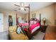 Main bedroom with a four-poster bed and sitting area at 11537 Southern Creek Dr, Gibsonton, FL 33534