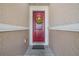 Red front door entrance with a sunflower wreath at 11537 Southern Creek Dr, Gibsonton, FL 33534