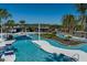 Large resort-style pool with expansive deck and shade structures at 5700 Spivey Ct, Wesley Chapel, FL 33545