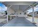 View of the carport and entrance of a single-story home at 4976 Britni Way, Zephyrhills, FL 33541