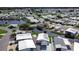 Aerial view of community with lake and homes at 4976 Britni Way, Zephyrhills, FL 33541