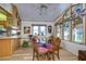 Bright dining area with round table and window seating at 4976 Britni Way, Zephyrhills, FL 33541