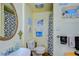 Bathroom with shower and playful decor at 4976 Britni Way, Zephyrhills, FL 33541