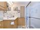 Clean bathroom with a shower/tub combo and wood vanity at 4976 Britni Way, Zephyrhills, FL 33541
