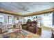 Relaxing living room with two recliners and a large TV at 4976 Britni Way, Zephyrhills, FL 33541