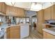 Kitchen with ample counter space and wood cabinets at 4976 Britni Way, Zephyrhills, FL 33541