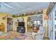 Living room with comfy seating and views into the kitchen and dining areas at 4976 Britni Way, Zephyrhills, FL 33541