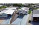 Aerial view of home with carport and landscaping at 4976 Britni Way, Zephyrhills, FL 33541