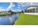 Scenic canal view with homes and lush landscaping along the bank at 4976 Britni Way, Zephyrhills, FL 33541