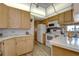 Bright kitchen with wood cabinets and modern appliances at 4976 Britni Way, Zephyrhills, FL 33541