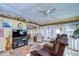 Spacious living room with comfortable seating and a view of the dining area at 4976 Britni Way, Zephyrhills, FL 33541