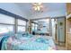 Bedroom with mirrored closet and a view at 4976 Britni Way, Zephyrhills, FL 33541