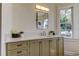 Modern bathroom with a double vanity, and large window at 921 Newberger Rd, Lutz, FL 33549