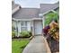Front entryway with walkway and landscaping at 2351 Bentley Dr, Palm Harbor, FL 34684