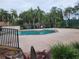 Community pool with surrounding patio and lush landscaping at 2351 Bentley Dr, Palm Harbor, FL 34684