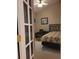 Bright bedroom with double bed, desk, and French doors at 2351 Bentley Dr, Palm Harbor, FL 34684
