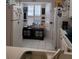 Cozy kitchen with white appliances and wood cabinets at 2351 Bentley Dr, Palm Harbor, FL 34684