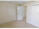 Spacious bedroom with double closet and access to hallway at 5904 Elm St, New Port Richey, FL 34652