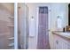 Bathroom with shower, vanity, and storage at 35210 Condominium Blvd, Zephyrhills, FL 33541