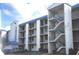 Three-story condo building with balconies and parking at 2424 W Tampa Bay Blvd # 108, Tampa, FL 33607