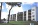 Three-story condo building with blue accents and balconies at 2424 W Tampa Bay Blvd # 108, Tampa, FL 33607