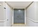 Building entry with double doors and neutral color palette at 220 Belleview Blvd # 802, Belleair, FL 33756
