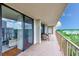 Relaxing balcony with sliding glass doors and outdoor furniture at 220 Belleview Blvd # 802, Belleair, FL 33756