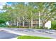 Multi-story building with mature landscaping and ample parking at 220 Belleview Blvd # 802, Belleair, FL 33756