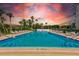 Inviting community swimming pool with surrounding lounge chairs and tables at 220 Belleview Blvd # 802, Belleair, FL 33756