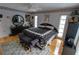 Spacious bedroom with hardwood floors and a large bed at 7906 Willow Brook Ct, Hudson, FL 34667