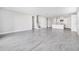 Open-concept living space with hardwood floors flowing into a modern kitchen at 1946 Longliner Loop, Wesley Chapel, FL 33543